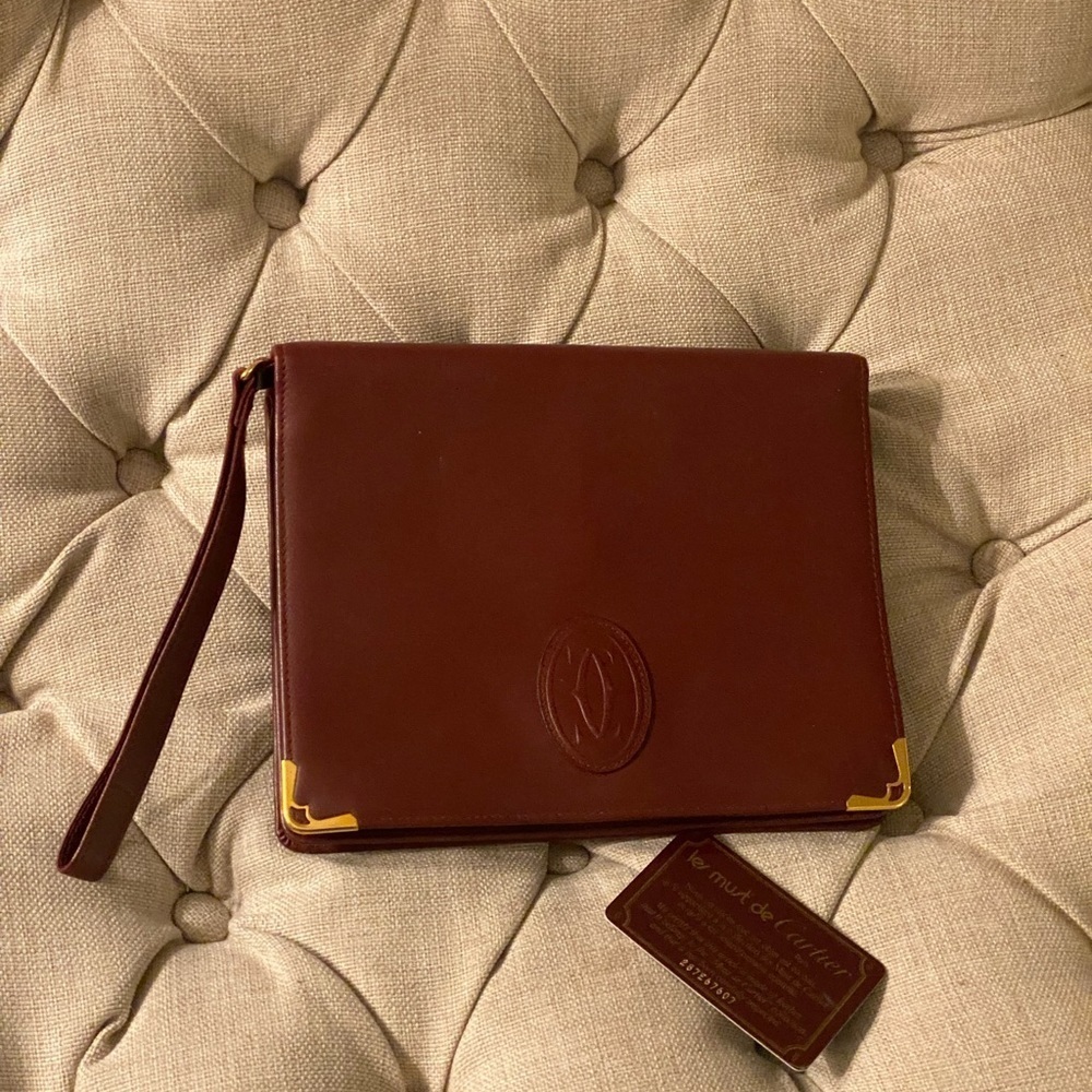 Stunning Cartier vintage large burgundy wristlet bag